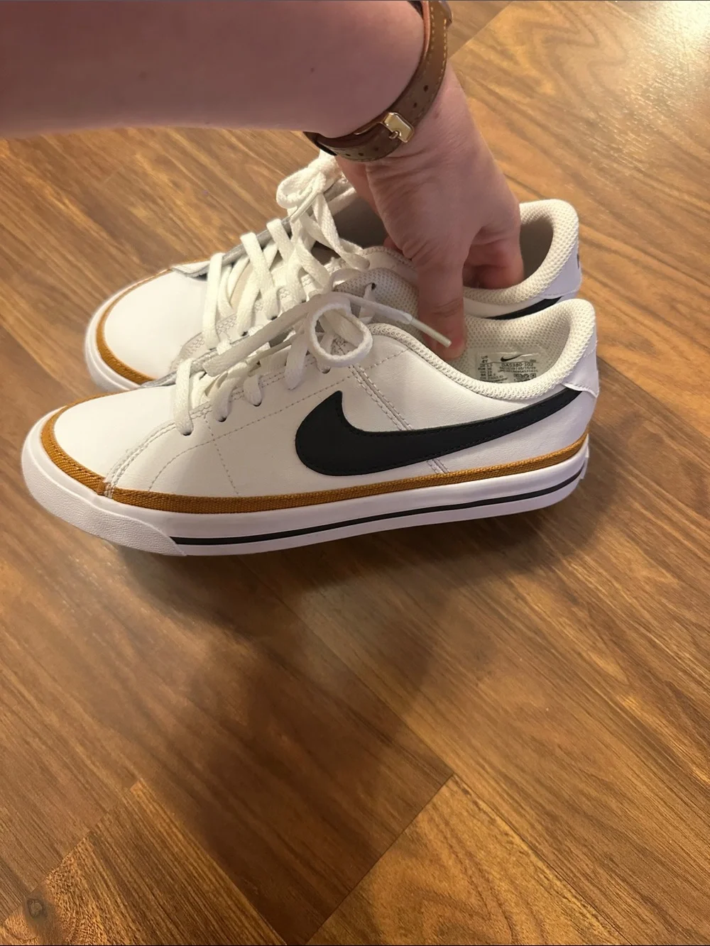 Nike Kid Low-Top Sneakers in White, Black & Gold